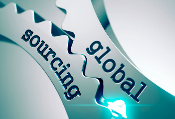 Interlocking metallic gear mechanism engraved with the words "global sourcing".